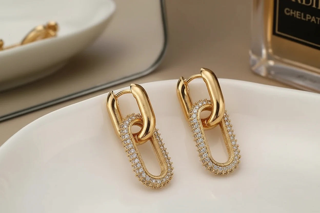 Gold Link Drop Earrings close-up on a white tray with sparkly pavé details | OriaJewel