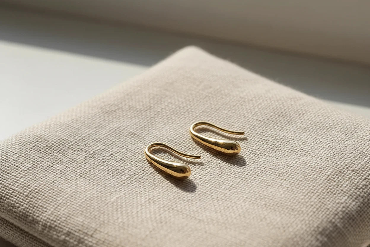 Gold Minimal Teardrop Hook Earrings close-up on linen fabric in soft light | OriaJewel