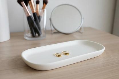 Gold Minimal Teardrop Hook Earrings on white tray vanity scene | OriaJewel