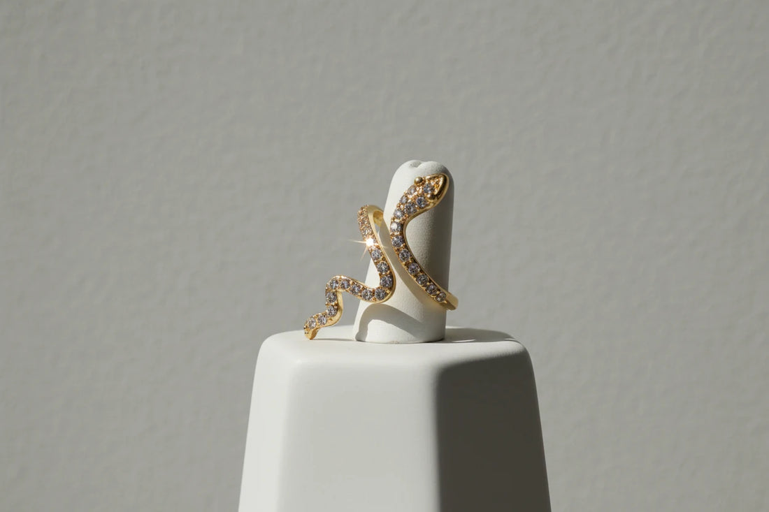 gold Pavé snake wrap ring on a white ring stand with a clean studio background | OriaJewel