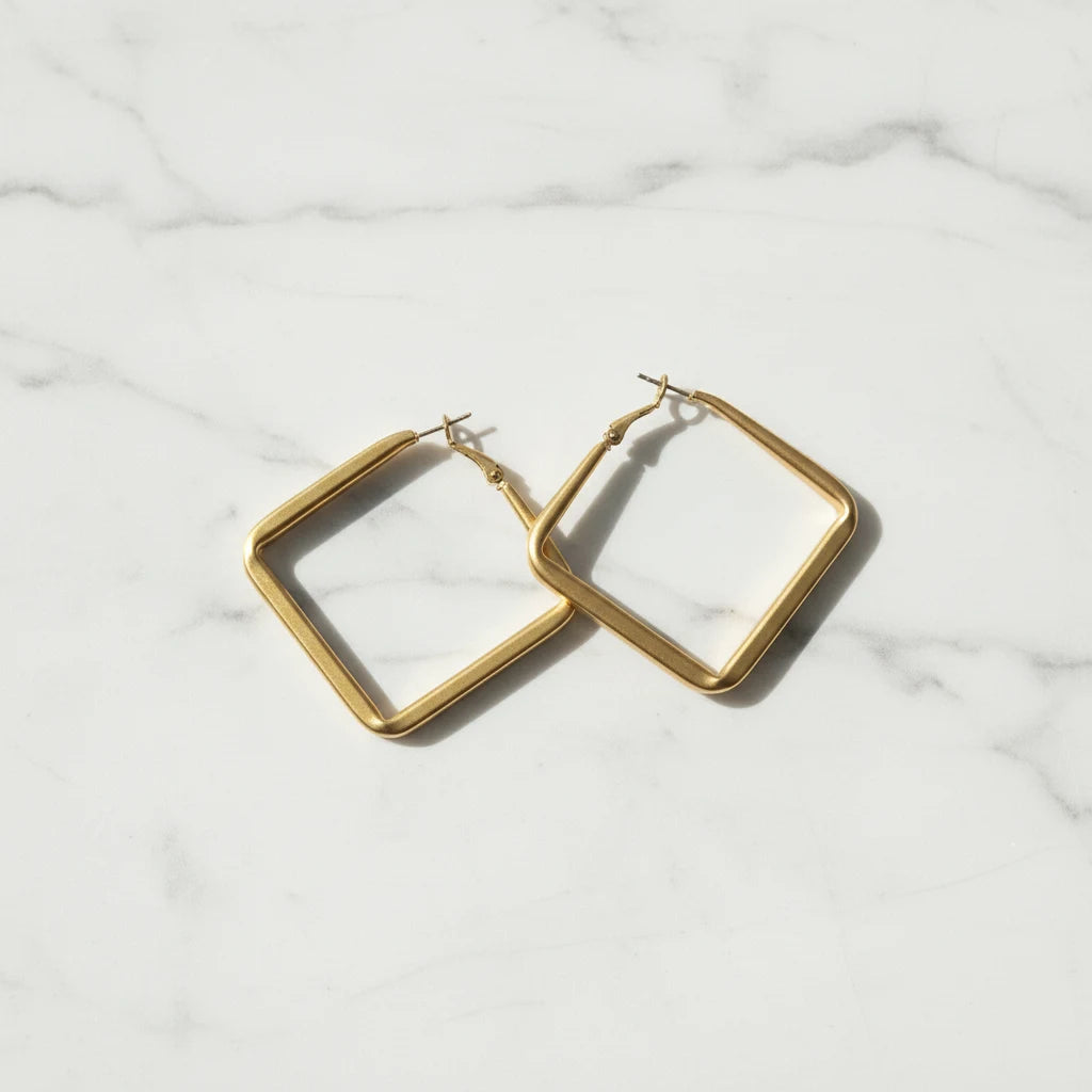 Gold Square Hoop Earrings pair on white marble background | OriaJewel