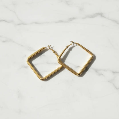 Gold Square Hoop Earrings pair on white marble background | OriaJewel