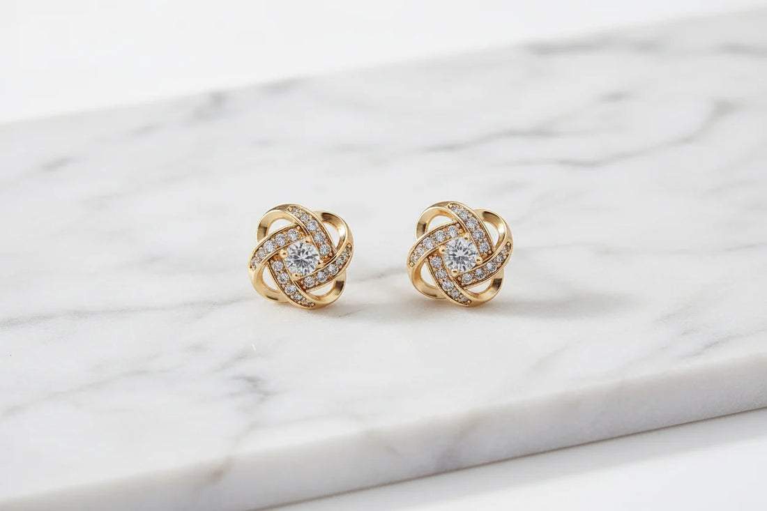 Gold Tone Knot Halo Stud Earrings close-up on marble surface | OriaJewel