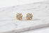 Gold Tone Knot Halo Stud Earrings close-up on marble surface | OriaJewel