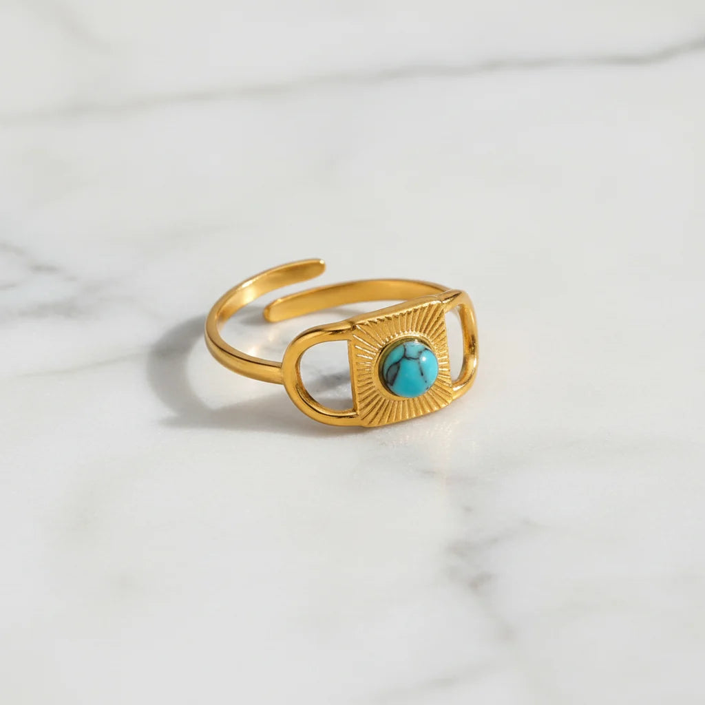 Gold Turquoise Adjustable Open Ring product shot on a light marble background, showcasing the open adjustable band and the turquoise centerpiece with clean minimal styling | OriaJewel