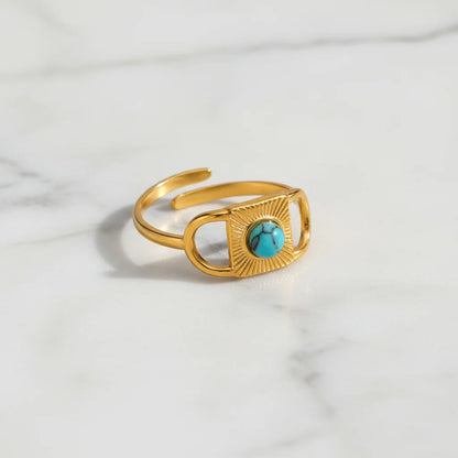 Gold Turquoise Adjustable Open Ring product shot on a light marble background, showcasing the open adjustable band and the turquoise centerpiece with clean minimal styling | OriaJewel