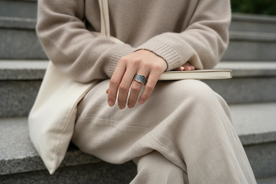 Gray Marble Open Wave Ring worn on hand turning a book page, cozy neutral outfit background | OriaJewel