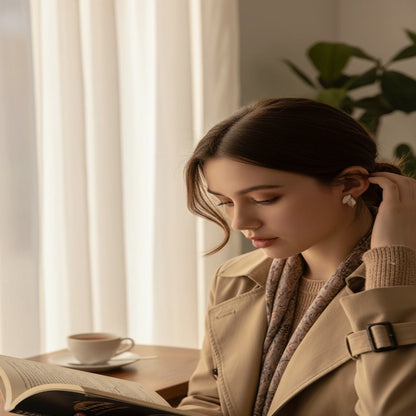Gray Double Leaf Stud Earrings worn on model in cozy cafe reading scene | OriaJewel