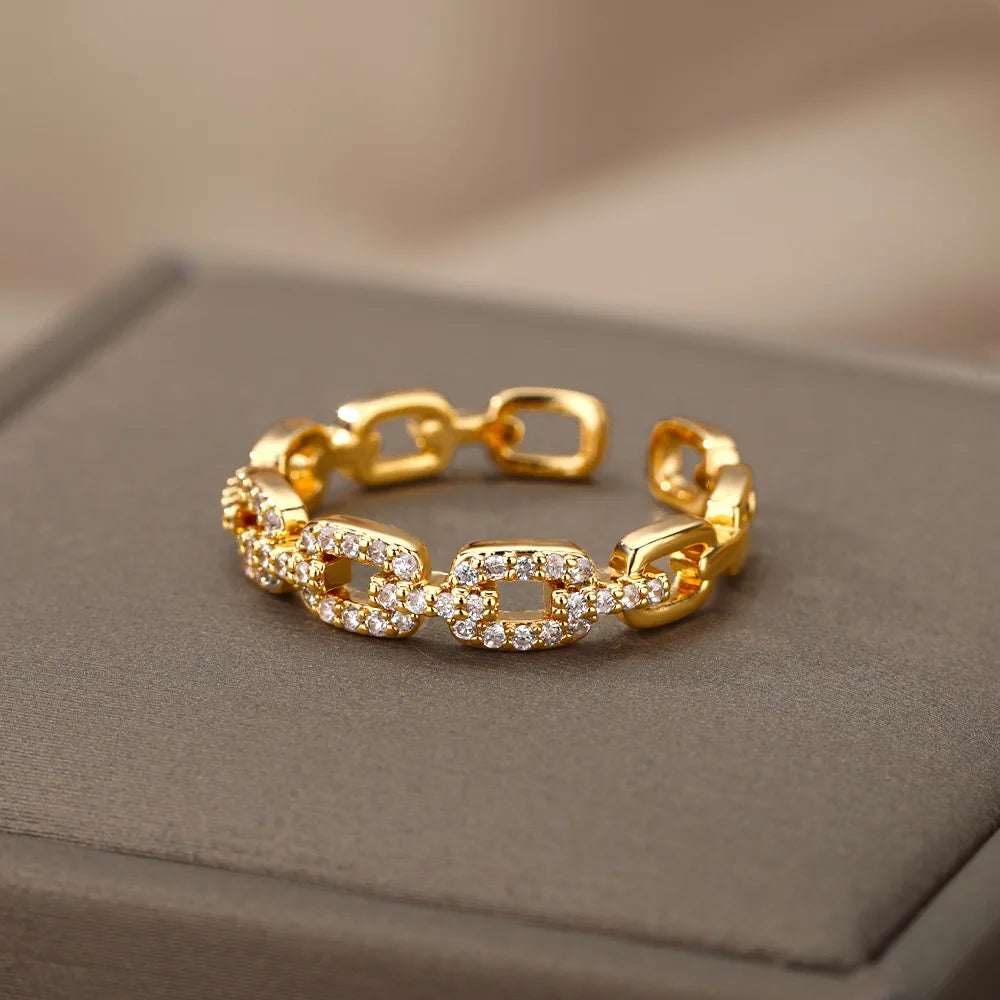 Gold Crystal Link Chain Ring with sparkling accents displayed on a soft surface | Oria Jewel