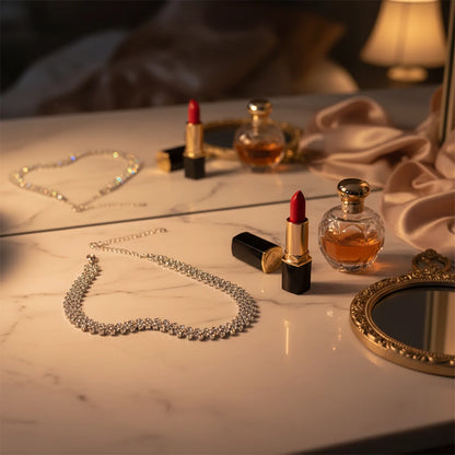 Luxury Rhinestone Chain Choker displayed on marble vanity with red lipstick, perfume bottle, and golden mirror | Oria Jewel