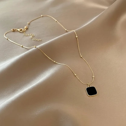 Minimalist Square Pendant Choker featuring a black square pendant on a delicate gold chain | Oria Jewel