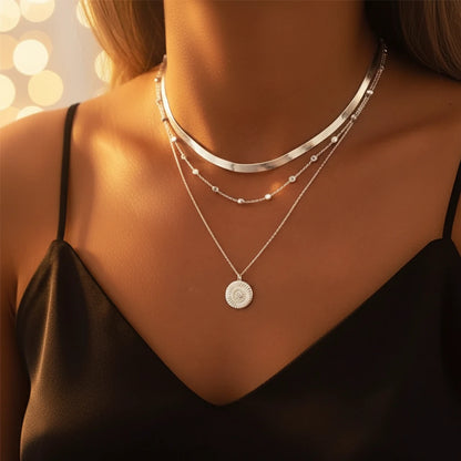 Multi Layer Silver Circle Chain Necklace worn with black satin dress under warm lights for an evening look | Oria Jewel