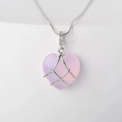 Natural Moonstone Pendant with silver heart cage on white background | Oria Jewel