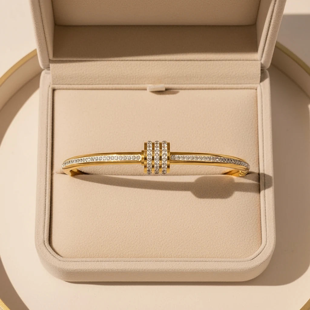 Gift-ready presentation of the Pavé Stackable Gold Bangle nestled in a beige jewelry box, emphasizing its luxurious gold shine and three stacked pavé crystal rows as the perfect special-occasion present | Oria Jewel