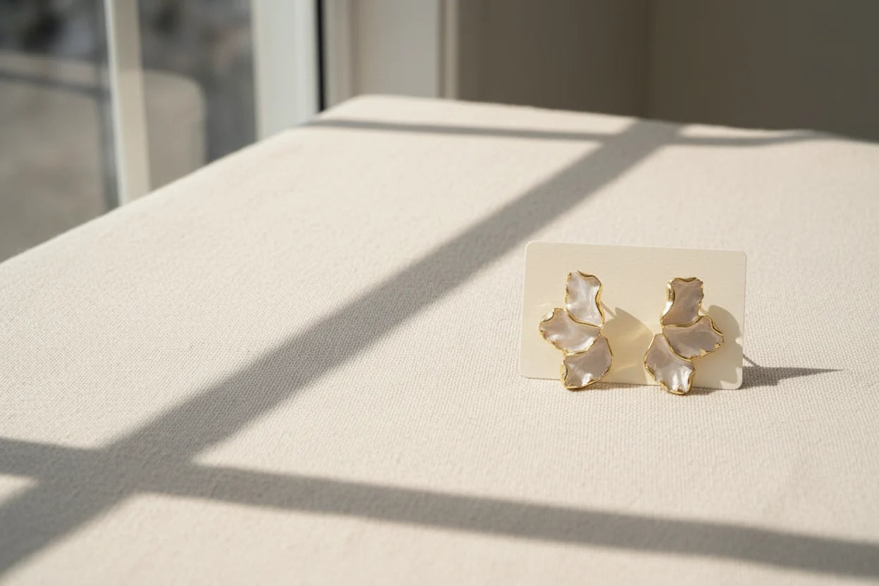 Pearl Petal Statement Stud Earrings on card with soft sunlight | OriaJewel
