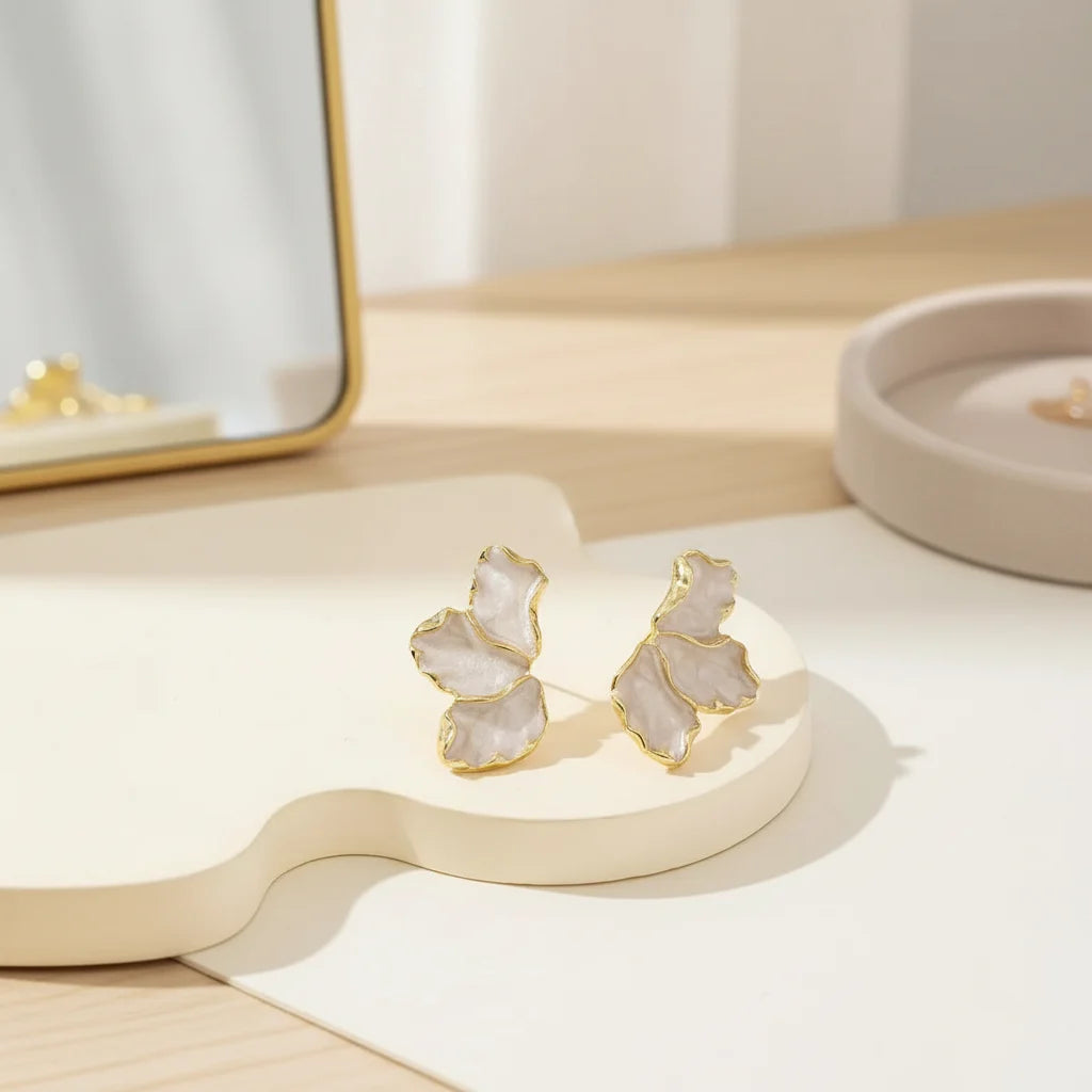 Pearl Petal Statement Stud Earrings close-up on modern tabletop | OriaJewel