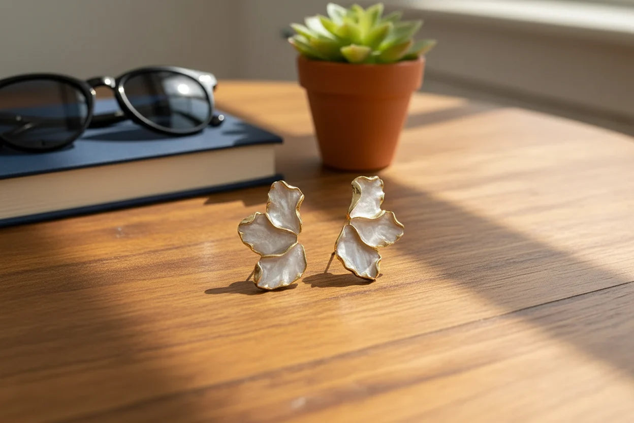 Pearl Petal Statement Stud Earrings on wooden desk with warm light | OriaJewel