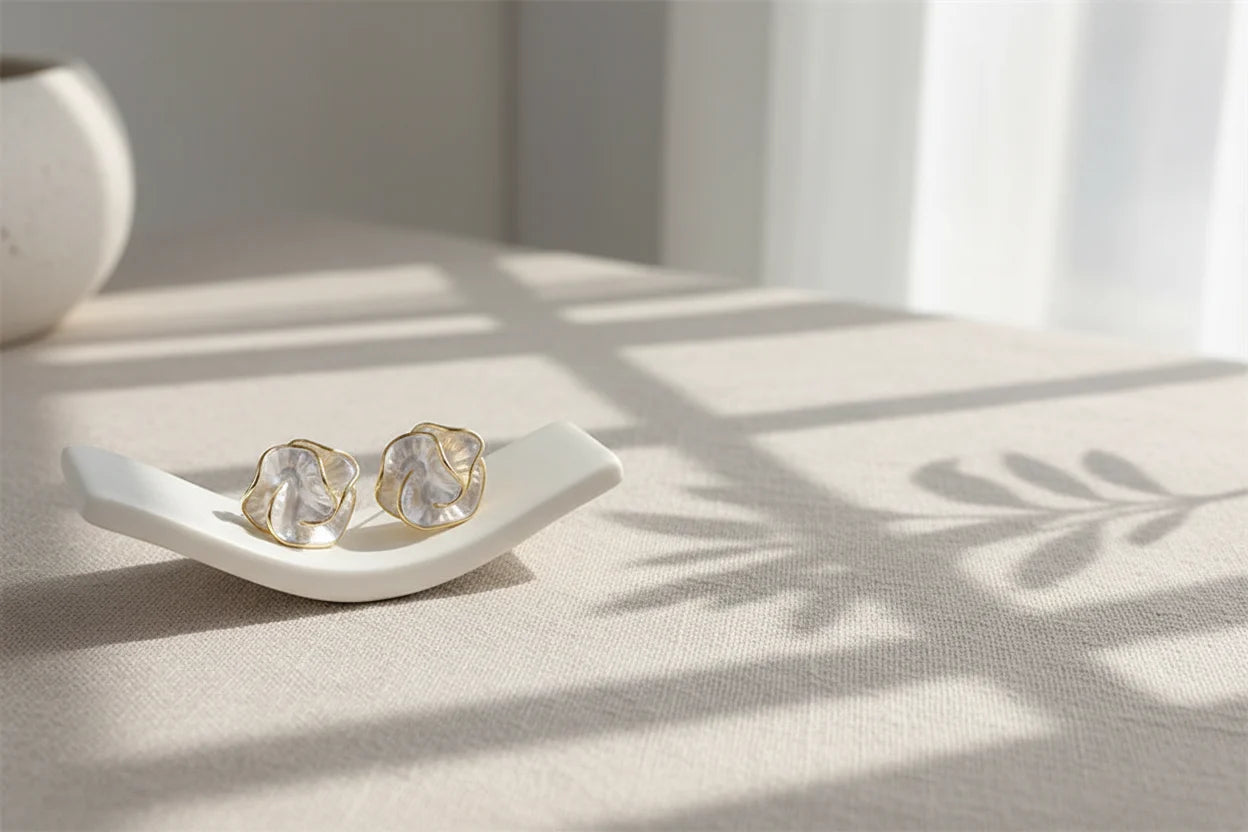 Pearl Rosette Stud Earrings on white display with soft shadow light | OriaJewel