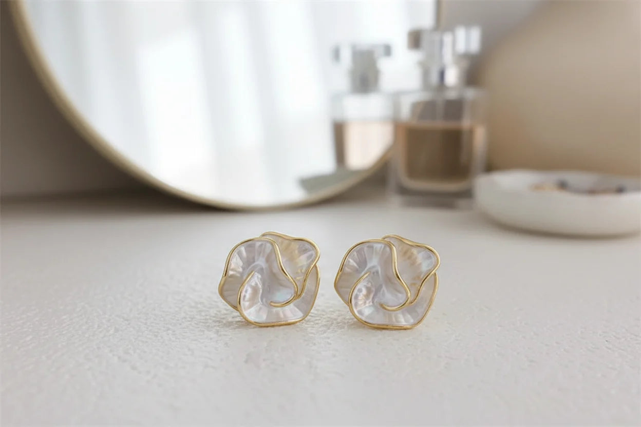 Pearl Rosette Stud Earrings on vanity surface with mirror background | OriaJewel