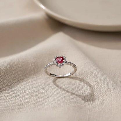 Ring standing on soft fabric with clean shadow, Red Heart Halo CZ Ring | OriaJewel