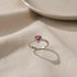 Ring standing on soft fabric with clean shadow, Red Heart Halo CZ Ring | OriaJewel