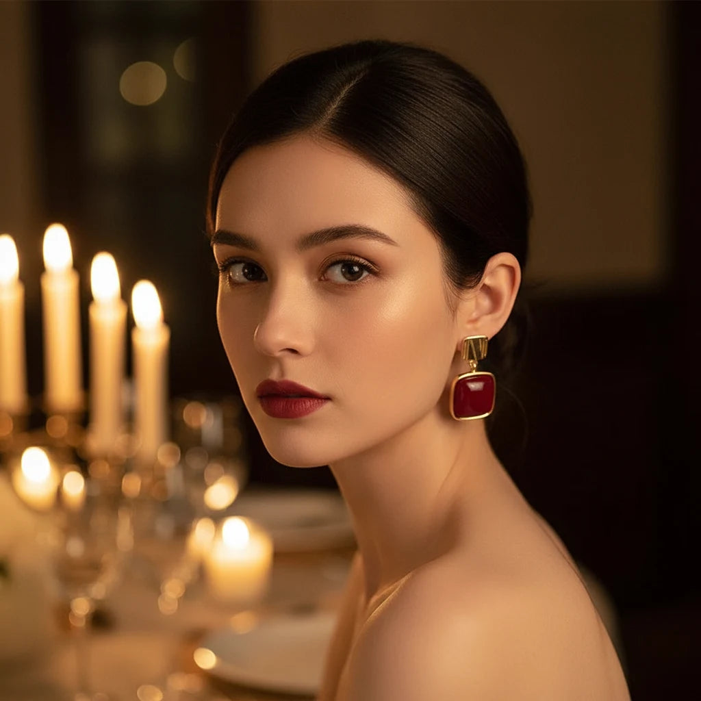 Red Square Drop Earrings on model with sleek updo and candlelit dinner background | OriaJewel