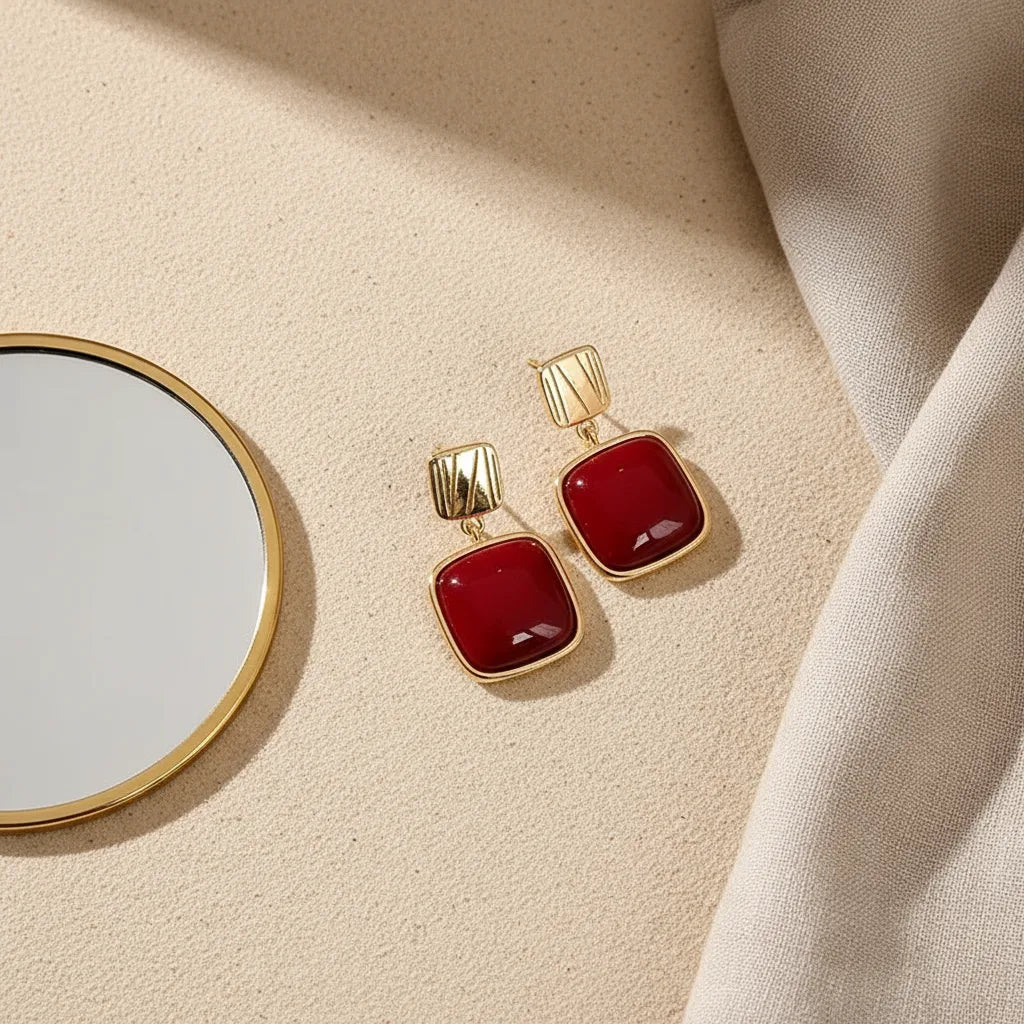 Red Square Drop Earrings product shot on beige surface near a round mirror | OriaJewel