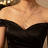 Model showcasing a stylish Retro Butterfly Chain Set with layered gold chains and pearls.