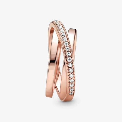 Rose Gold Criss Cross CZ Band Ring vertical product shot on a white background, detailed view of the criss-cross wrap silhouette with one pavé CZ line and smooth polished rose gold bands | OriaJewel