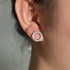 Hollow Zircon Earrings showcasing a circular design with sparkling zircon stones, perfect for adding elegance.