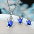 Close-up of sparkling silver Turtle Sapphire Jewelry Set on white surface | Oria Jewel