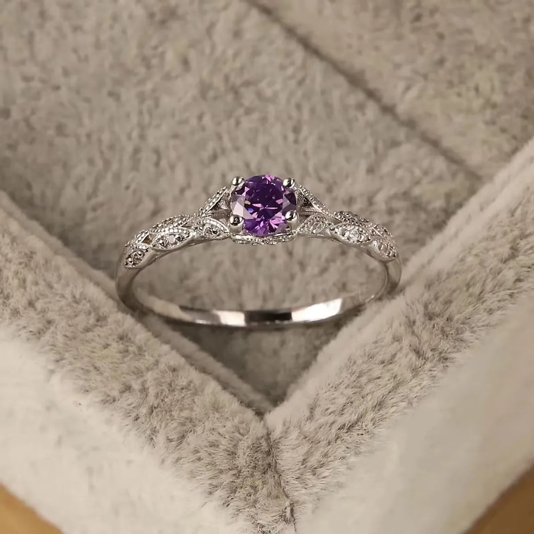 Violet Whisper Gemstone Ring with filigree silver band, glistening on grey velvet | Oria Jewel