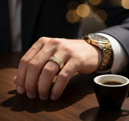Close-up of a hand wearing a Golden Edge Classic Band ring, with coffee cup and watch visible on the table | Oria Jewel