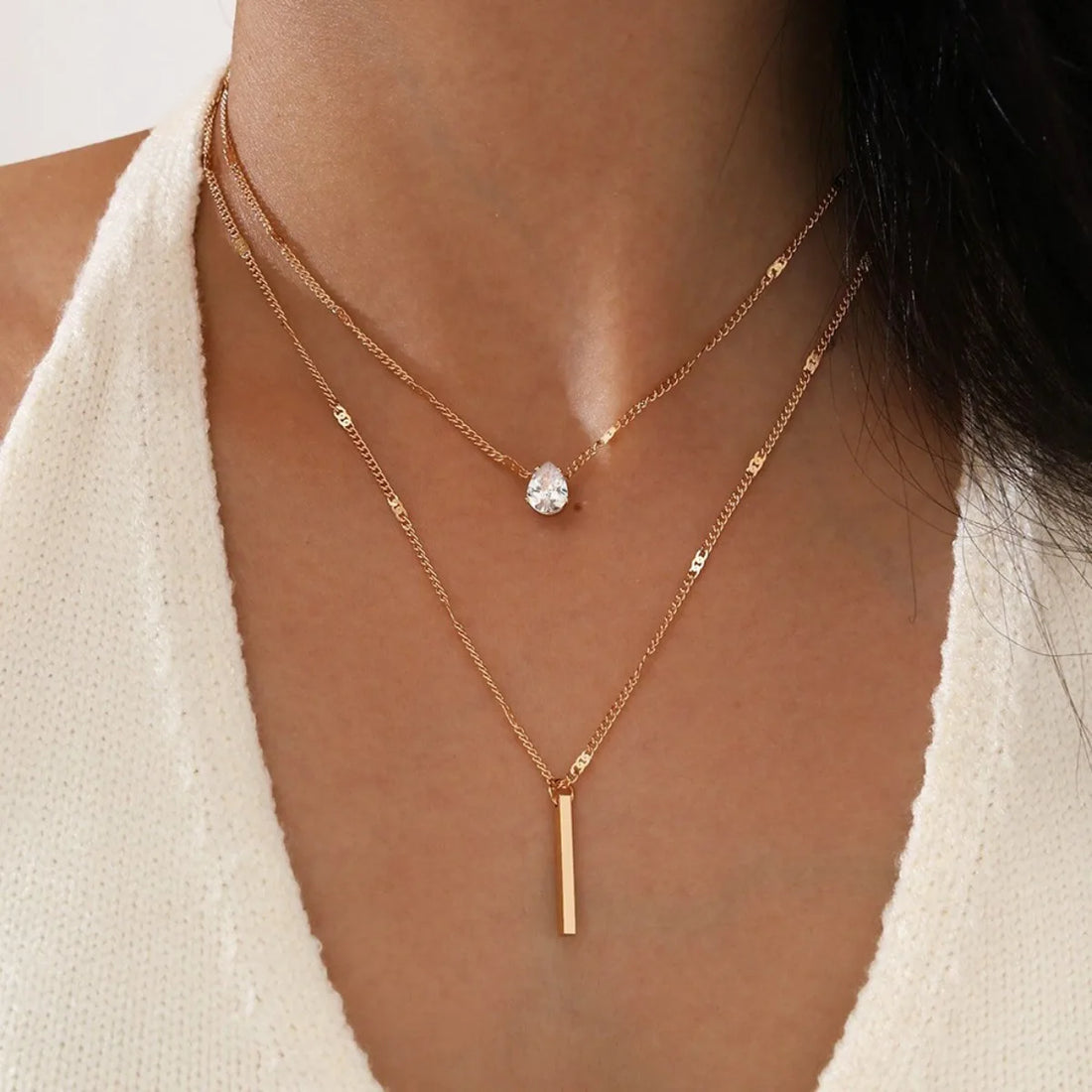 model wearing star layered necklace with minimalist outfit | Oria Jewel