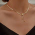 Woman wearing Gold Butterfly Chain Necklace with layered accessories | Oria Jewel