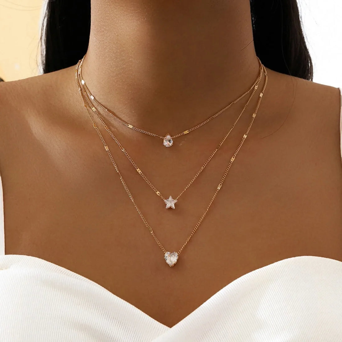 model wearing cosmic star necklace with minimal outfit | Oria Jewel
