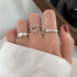 Butterfly & Pearl Stacking Ring Set featuring three elegant silver rings on a model&