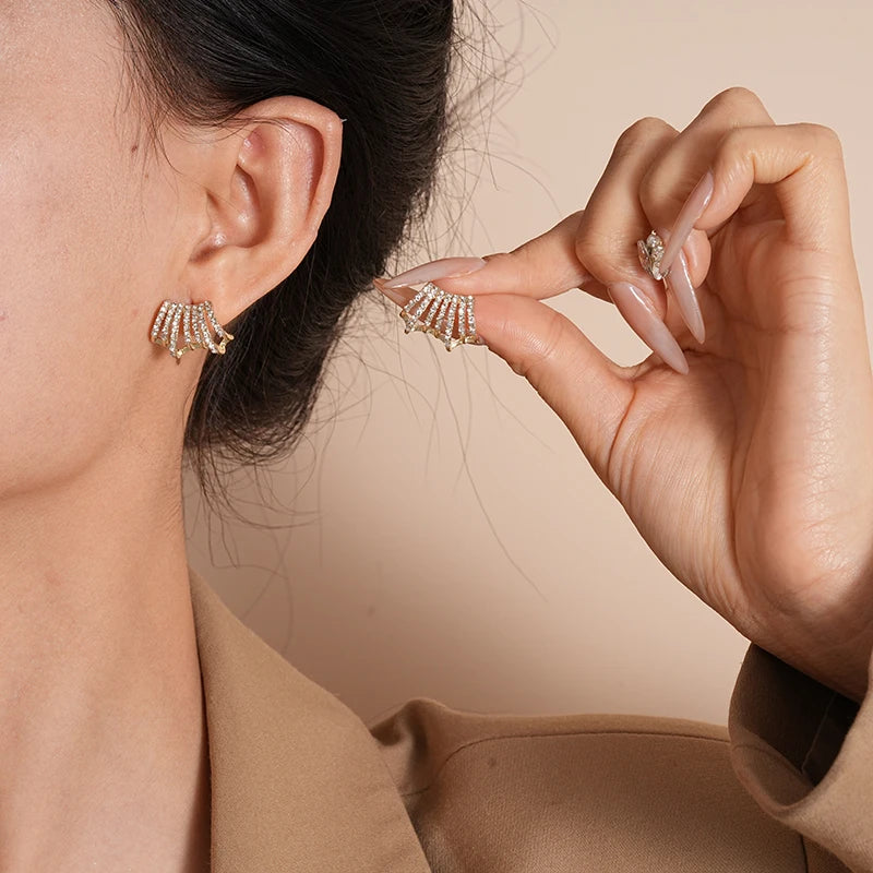 Shimmering Delicate Rhinestone Stud Earrings worn on ear and held by fingers | Oria Jewel