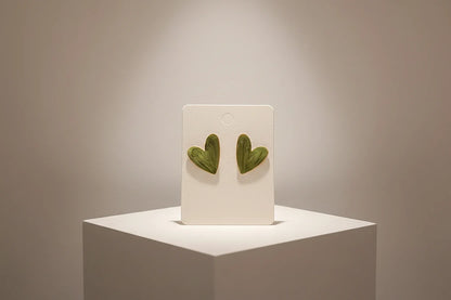 Sage Green Marble Heart Stud Earrings on display card on pedestal | OriaJewel