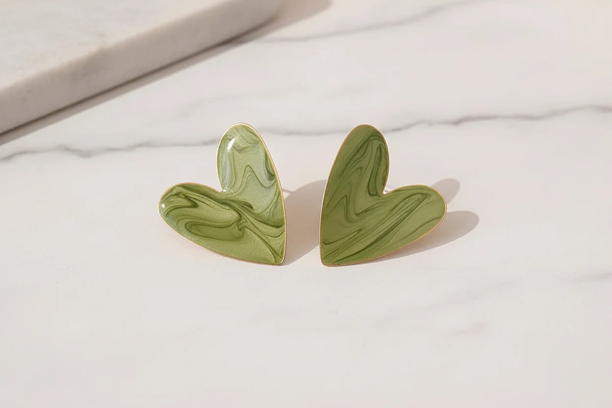 Sage Green Marble Heart Stud Earrings close-up on marble showing heart shape | OriaJewel
