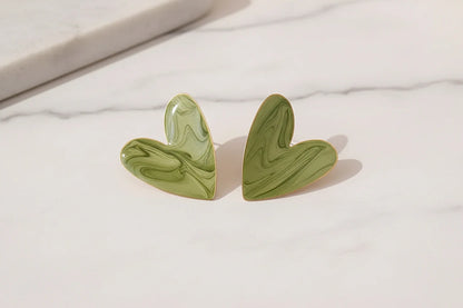 Sage Green Marble Heart Stud Earrings close-up on marble showing heart shape | OriaJewel