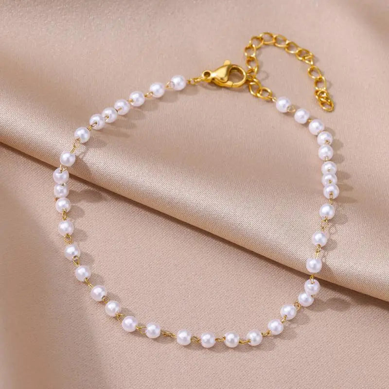 gold pearl anklet jewelry close-up with delicate pearls and chain | Oria Jewel