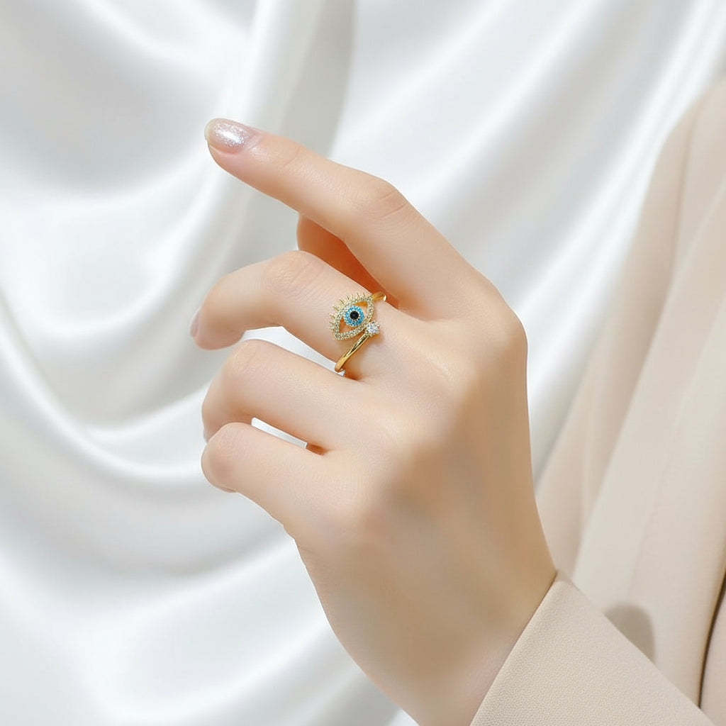 Elegant hand wearing a Blue Crystal Evil Rings, showcasing intricate design and sparkling details | Oria Jewel