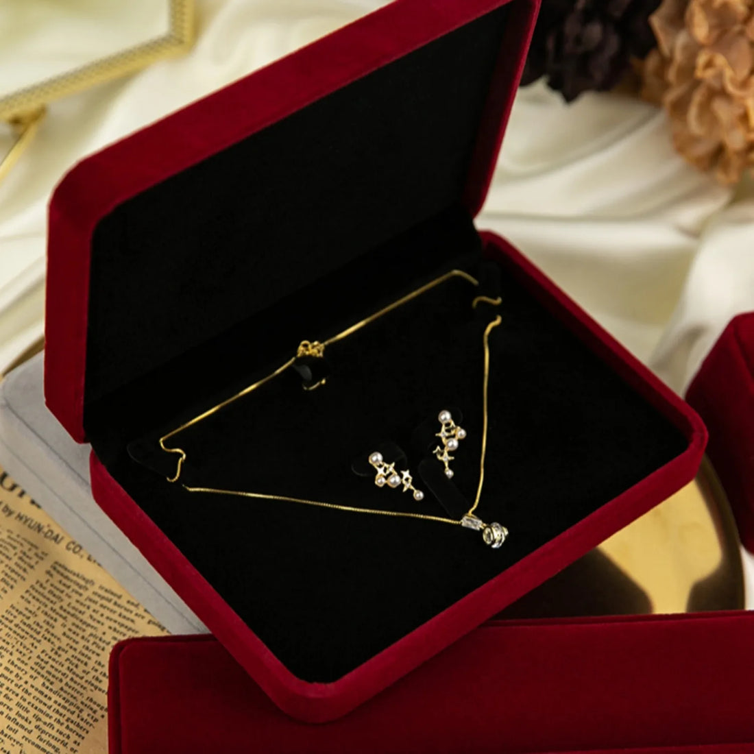 Compact Flannel Jewelry Display Box holding silver rings and earrings | Oria Jewel