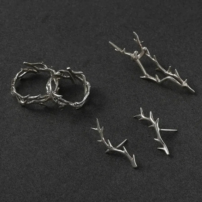 Close-up of a Silver Antler Wrap Ring standing upright on a dark background, highlighting the branch-inspired wrap details and sculpted silver finish | OriaJewel