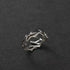 Silver Antler Wrap Ring set arranged on a matte black background with spiky branch-shaped silver pieces, showcasing the rugged wrap aesthetic and sharp accents | OriaJewel