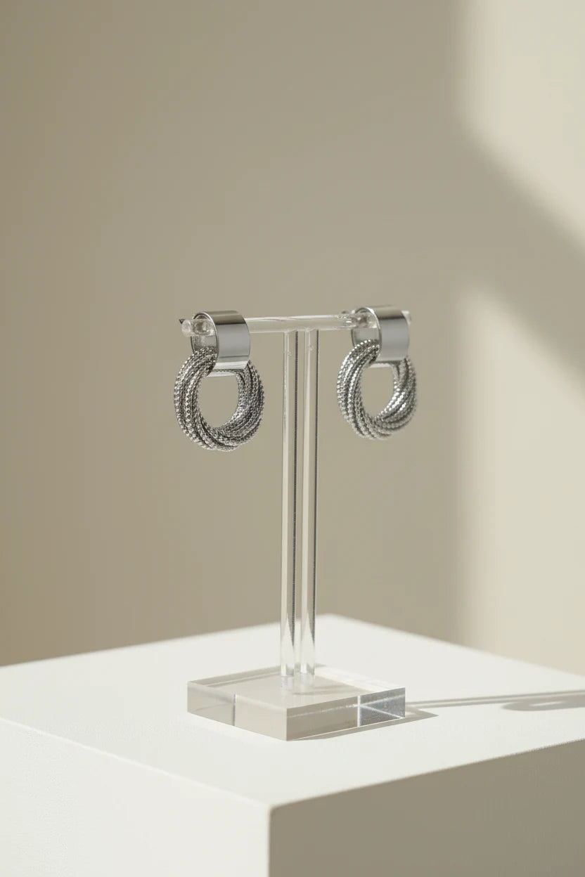 Silver Circle Drop Stud Earrings on clear stand with soft shadows | OriaJewel