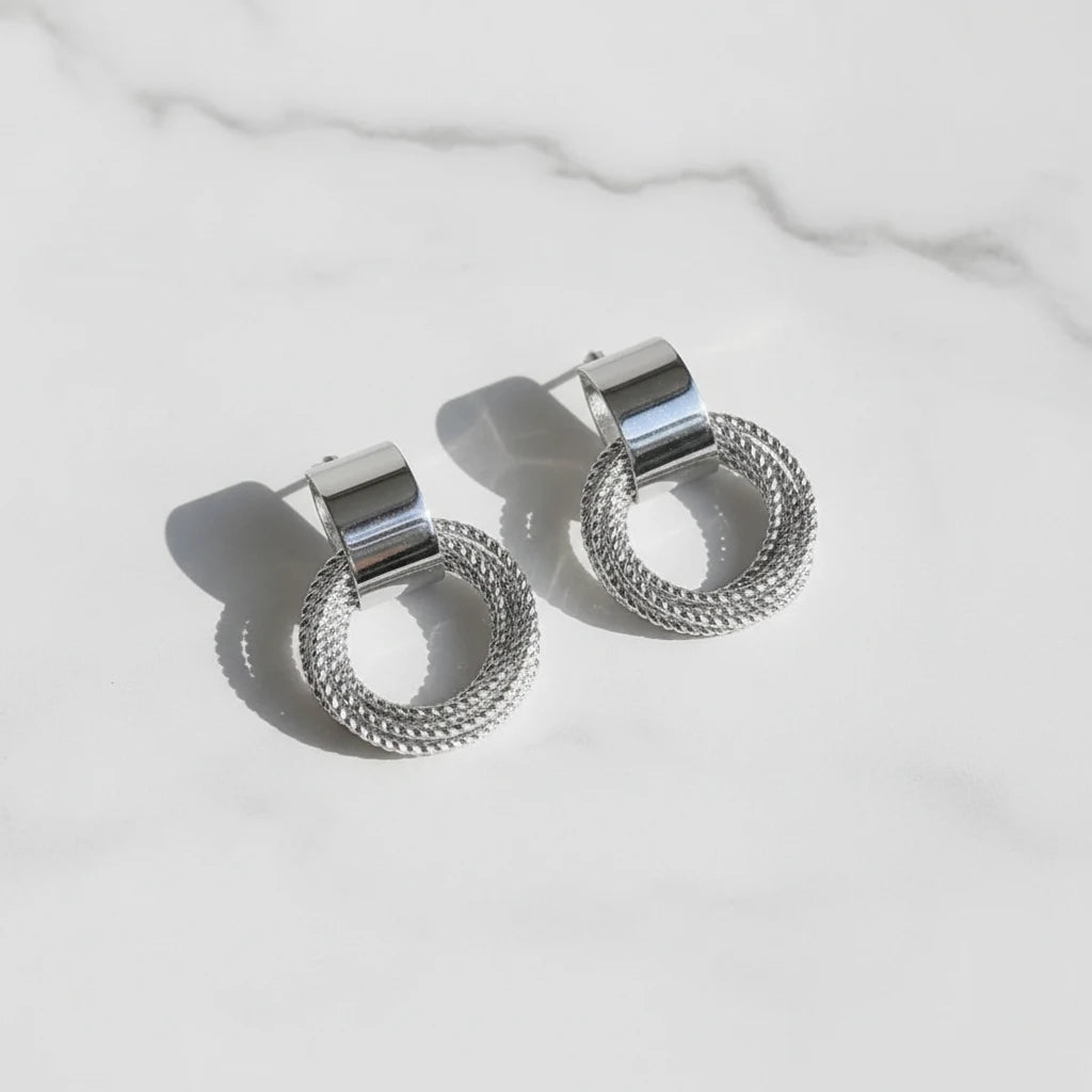 Silver Circle Drop Stud Earrings on marble with natural light | OriaJewel