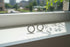 Silver Circle Stud Earrings on windowsill with soft natural light | OriaJewel
