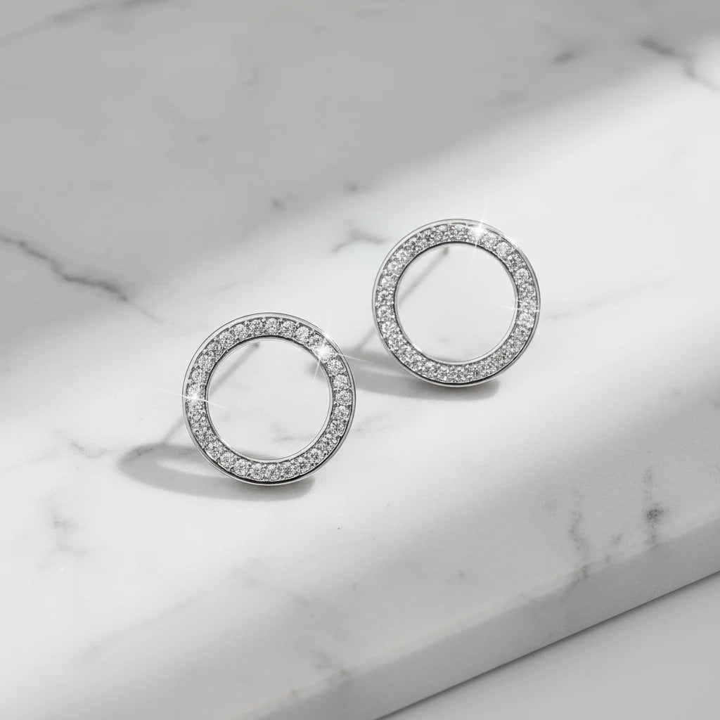 Silver Circle Stud Earrings on marble surface close-up | OriaJewel